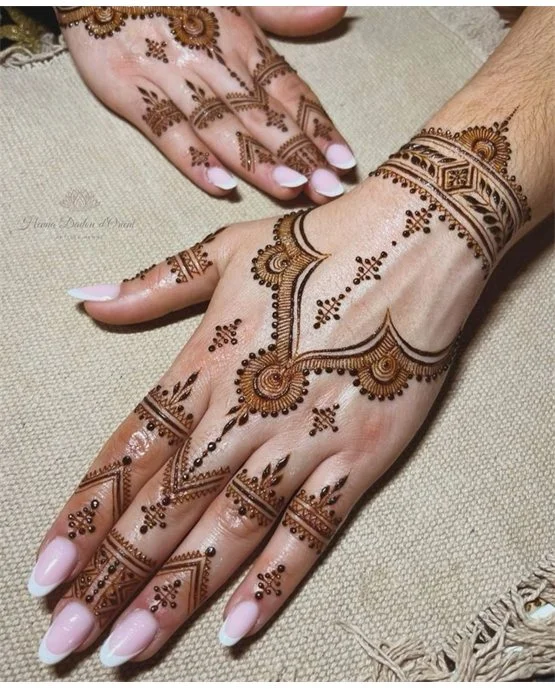 Detailed Fan With Cluster Covering Back Hand Mehndi Design